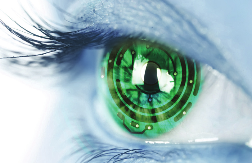 Close-up of a green eye with a circuit-board pattern in the iris
